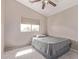 Bedroom featuring neutral tones and a window with a blind, offering a comfortable space at 41838 W Anne Ln, Maricopa, AZ 85138