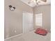 Bedroom with a ceiling fan, closet, and window; this room is awaiting its furnishings at 41838 W Anne Ln, Maricopa, AZ 85138