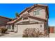 Two-story home with a tile roof, stucco exterior, and a two-car garage at 41838 W Anne Ln, Maricopa, AZ 85138