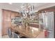 Well-lit kitchen featuring a center island, stainless steel appliances, and ample counter space at 41838 W Anne Ln, Maricopa, AZ 85138