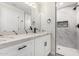 Stylish bathroom featuring white marble countertops and a walk-in shower at 4402 E Mitchell Dr, Phoenix, AZ 85018