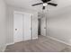 Bedroom with sliding door closet and ceiling fan at 4402 E Mitchell Dr, Phoenix, AZ 85018