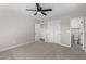 Bedroom with carpet, ceiling fan, closet and bathroom access at 4402 E Mitchell Dr, Phoenix, AZ 85018