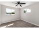 Bedroom with natural light from two windows and neutral carpet at 4402 E Mitchell Dr, Phoenix, AZ 85018