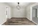 Cozy dining room with modern light fixture and wood flooring at 4402 E Mitchell Dr, Phoenix, AZ 85018