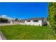 Beautifully landscaped lawn surrounds the exterior of this single-story residence at 4402 E Mitchell Dr, Phoenix, AZ 85018