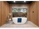 Modern bathroom featuring a freestanding tub by a picture window for natural light at 5301 E Paradise Canyon Rd, Paradise Valley, AZ 85253