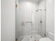 This bathroom features a frameless shower enclosure, white tiling, and modern gold fixtures at 5301 E Paradise Canyon Rd, Paradise Valley, AZ 85253