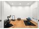 Bright, spacious exercise room featuring hardwood floors and ample space for fitness equipment at 5301 E Paradise Canyon Rd, Paradise Valley, AZ 85253