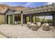 Back patio area with pergola cover has comfortable seating and a view of the Arizona mountain backdrop at 5301 E Paradise Canyon Rd, Paradise Valley, AZ 85253