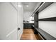 Walk-in pantry with wood flooring features custom shelving and plenty of storage space at 5301 E Paradise Canyon Rd, Paradise Valley, AZ 85253