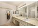 Bathroom with dual sinks, vanity, and a separate enclosed shower area, offering a spa-like experience at 5401 S Siesta Ln, Tempe, AZ 85283