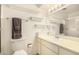 Bright bathroom featuring a white vanity and a large mirror with Hollywood style lighting at 5401 S Siesta Ln, Tempe, AZ 85283