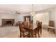 Open-concept dining room with tiled floors, decorative lighting, and seamless access to the living area at 5401 S Siesta Ln, Tempe, AZ 85283