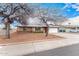 Charming single-story home featuring a two-car garage, brick accents, and a well-maintained front yard at 5401 S Siesta Ln, Tempe, AZ 85283