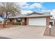 Charming single-story home featuring a two-car garage, brick accents, and a well-maintained front yard at 5401 S Siesta Ln, Tempe, AZ 85283