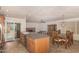 Open kitchen and dining area, highlighted by natural light, an island, and convenient access to a cozy living space at 5401 S Siesta Ln, Tempe, AZ 85283