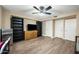 Bedroom features hardwood floors, ceiling fan, dresser, and closet space at 567 W 6Th St, Tempe, AZ 85281