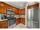 Kitchen showcases stainless steel refrigerator and gas range with abundant cabinetry at 567 W 6Th St, Tempe, AZ 85281