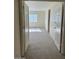 Bedroom featuring carpeted floors with an open doorway at 6780 W Yearling Rd, Peoria, AZ 85383