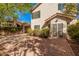 Paver backyard featuring lush greenery, mature trees, and a secure fenced-in yard at 73 E Caroline Ln, Tempe, AZ 85284