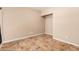 Bedroom featuring neutral walls and tile flooring; electrical outlets are conveniently spaced around the room at 73 E Caroline Ln, Tempe, AZ 85284