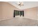 Bright and spacious bedroom featuring a high ceiling, carpet flooring and a large window at 73 E Caroline Ln, Tempe, AZ 85284