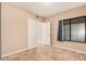 Bedroom featuring a closet, window and neutral walls and tile flooring at 73 E Caroline Ln, Tempe, AZ 85284