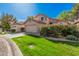 Single-Gathering home featuring a well-maintained lawn, a two-car garage, and mature landscaping at 73 E Caroline Ln, Tempe, AZ 85284