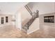 Bright living area with tile flooring, staircase, and lots of natural light from a sliding glass door at 73 E Caroline Ln, Tempe, AZ 85284