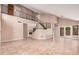 Bright and airy living room features a staircase, fireplace, and tile flooring throughout at 73 E Caroline Ln, Tempe, AZ 85284