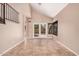 Living room showcasing neutral paint, tile flooring, and natural light from a sliding glass door at 73 E Caroline Ln, Tempe, AZ 85284