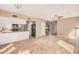 This living room offers tile flooring and connects seamlessly to the kitchen and staircase at 73 E Caroline Ln, Tempe, AZ 85284