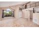 Open-concept living room with high ceilings, large window, and tile flooring at 73 E Caroline Ln, Tempe, AZ 85284