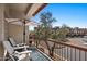 Enjoy the community view from this lovely balcony with chairs, umbrella, and a relaxing atmosphere at 7420 E Northland Dr # B101, Scottsdale, AZ 85251