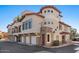 Multi-level townhome featuring private garages, second-story balconies, and classic stucco siding at 7420 E Northland Dr # B101, Scottsdale, AZ 85251