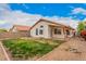 Backyard featuring partial grass, minimal landscaping, and a covered patio at 7929 W Wescott Dr, Glendale, AZ 85308