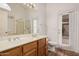 Bathroom featuring dual sinks, tile flooring, and a shower at 7929 W Wescott Dr, Glendale, AZ 85308