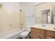 Bathroom featuring a shower and tub combination, a toilet, and a vanity at 7929 W Wescott Dr, Glendale, AZ 85308