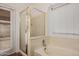 Bathroom featuring a shower, bathtub, and window at 7929 W Wescott Dr, Glendale, AZ 85308