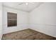 Neutral bedroom featuring a ceiling fan and a window with horizontal blinds at 7929 W Wescott Dr, Glendale, AZ 85308