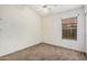 Bedroom with neutral walls and carpet and a window with blinds at 7929 W Wescott Dr, Glendale, AZ 85308