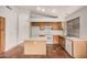 Well lit kitchen with center island, tile flooring, and plenty of counter space at 7929 W Wescott Dr, Glendale, AZ 85308