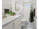 Well-lit bathroom with a shower-tub combo, a white vanity, and a decorative mirror creating a peaceful space at 8865 E Baseline Rd # 554, Mesa, AZ 85209