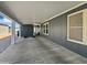 Spacious carport featuring a concrete floor, gray walls, and white ceiling at 8865 E Baseline Rd # 554, Mesa, AZ 85209