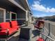 Relaxing patio featuring cozy red seating and a stylish fire pit, perfect for outdoor enjoyment and neighborhood views at 8865 E Baseline Rd # 554, Mesa, AZ 85209