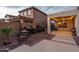 Outdoor kitchen area with built-in grills and dining table, perfect for outdoor entertaining and enjoying backyard gatherings at 9547 W Chama Dr, Peoria, AZ 85383