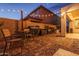 Outdoor kitchen area with built-in grills and dining table, perfect for outdoor entertaining and enjoying backyard gatherings at 9547 W Chama Dr, Peoria, AZ 85383