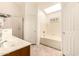 Bright bathroom with a bathtub and shower combo and single-sink vanity at 956 N 58Th St, Mesa, AZ 85205