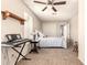 Bedroom features neutral walls, carpet, ceiling fan, and natural light at 956 N 58Th St, Mesa, AZ 85205